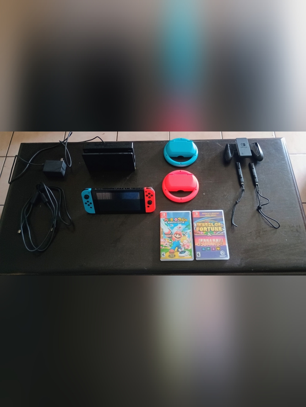 Nintendo Switch with Neon Red & Neon Blue Joy-Con and Racing Wheels And Games
